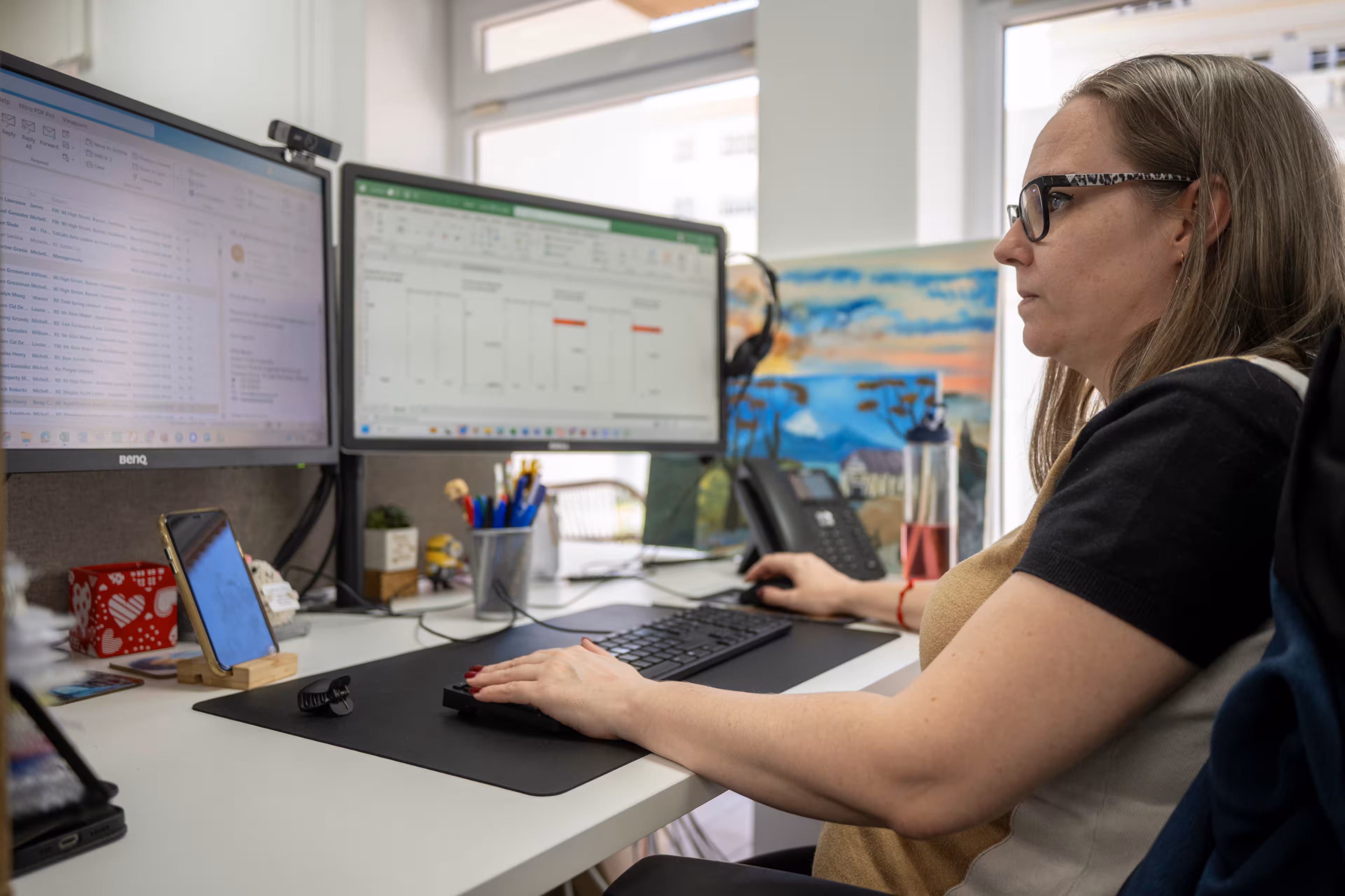 A person looking at a desktop screen