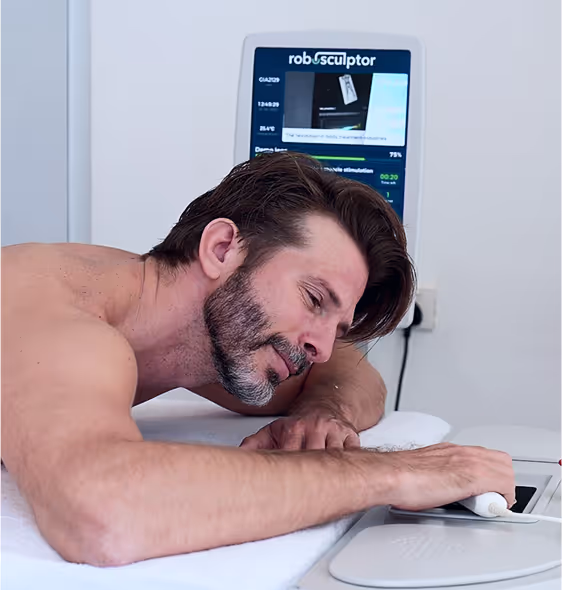A man laying on a roboSculptor massage table 