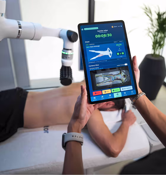 A person is holding a roboSculptor tablet
