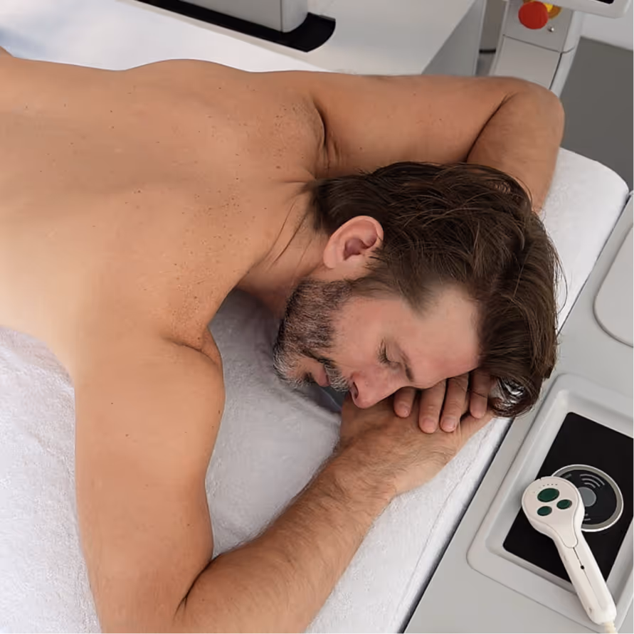man on roboSculptor massage table