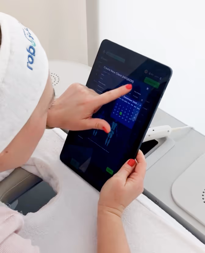 Woman creating an account on tablet for roboSculptor procedure