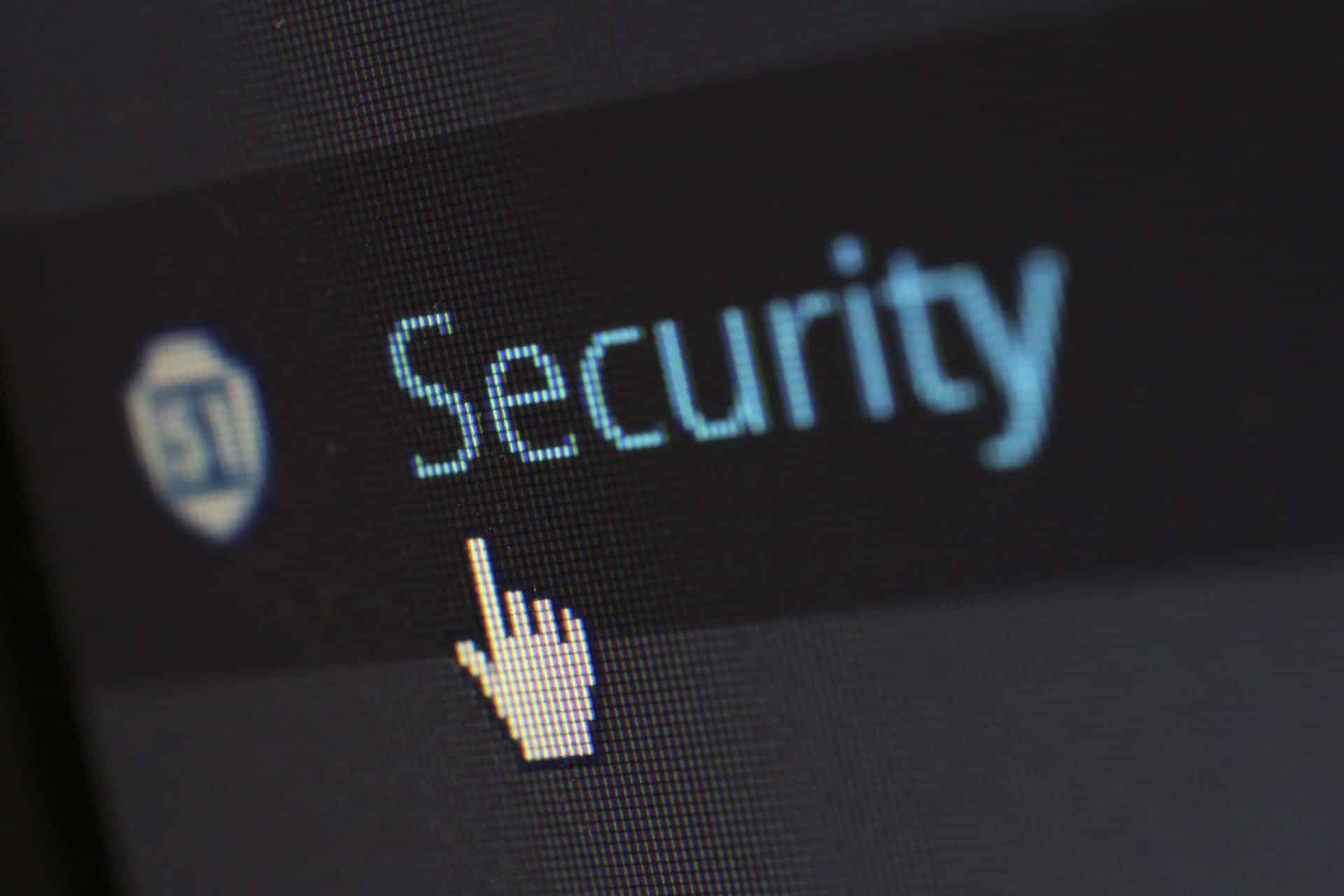 A cursor points to the word "Security" on a computer screen.