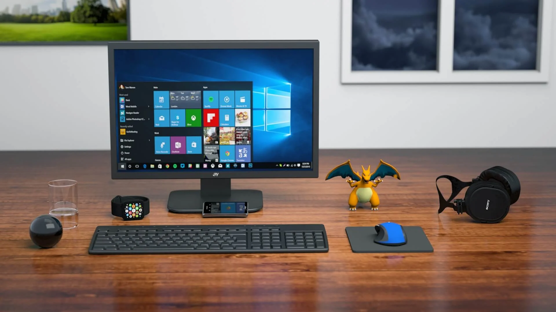 A desktop computer setup with a monitor, keyboard, and mouse on a wooden desk.