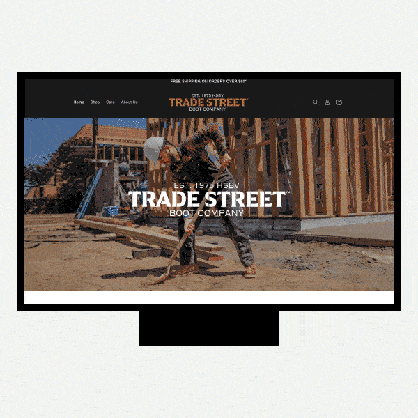 Website hero image for Trade Street Boot Company showing rugged leather work boots worn outdoors, set against a weathered industrial backdrop, with bold “TRADE STREET” branding that emphasizes heritage, durability, and workwear craftsmanship.