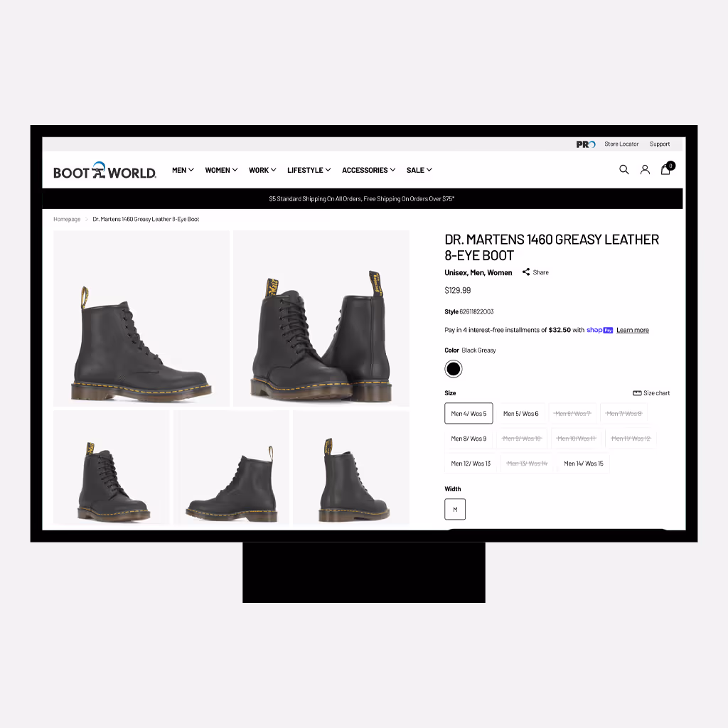 Desktop product detail page on the Boot World website for the Dr. Martens 1460 Greasy Leather 8-eye boot, showing multiple product images, pricing, size and width selection options, and navigation menus in a clean eCommerce layout.