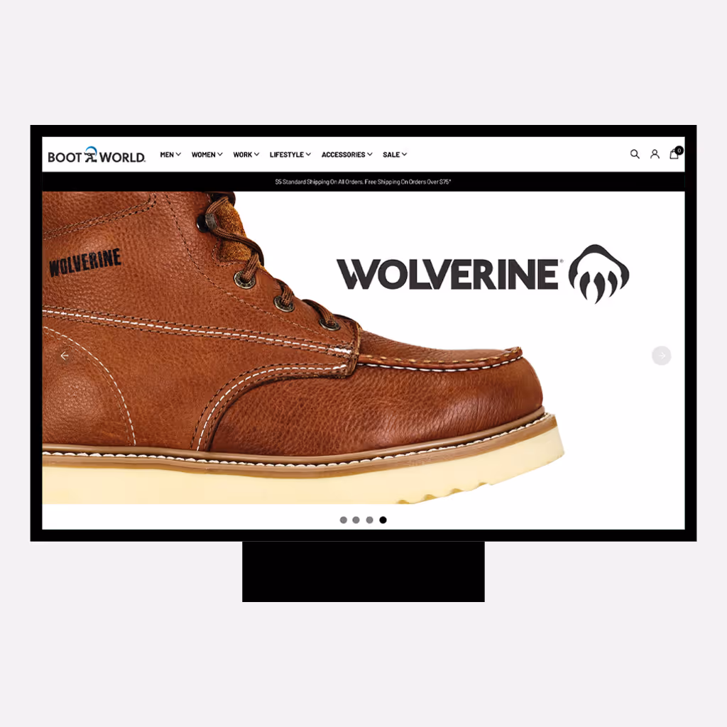 Desktop website mockup showing the Boot World homepage featuring a close-up of a brown Wolverine work boot, with the Wolverine logo displayed prominently on a clean white background and the Boot World navigation menu visible at the top.