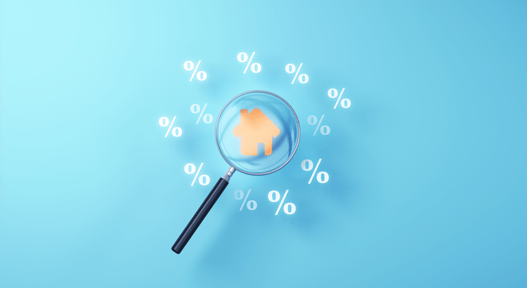 Magnifying glass over a small house surrounded by percentage symbols on a blue background.