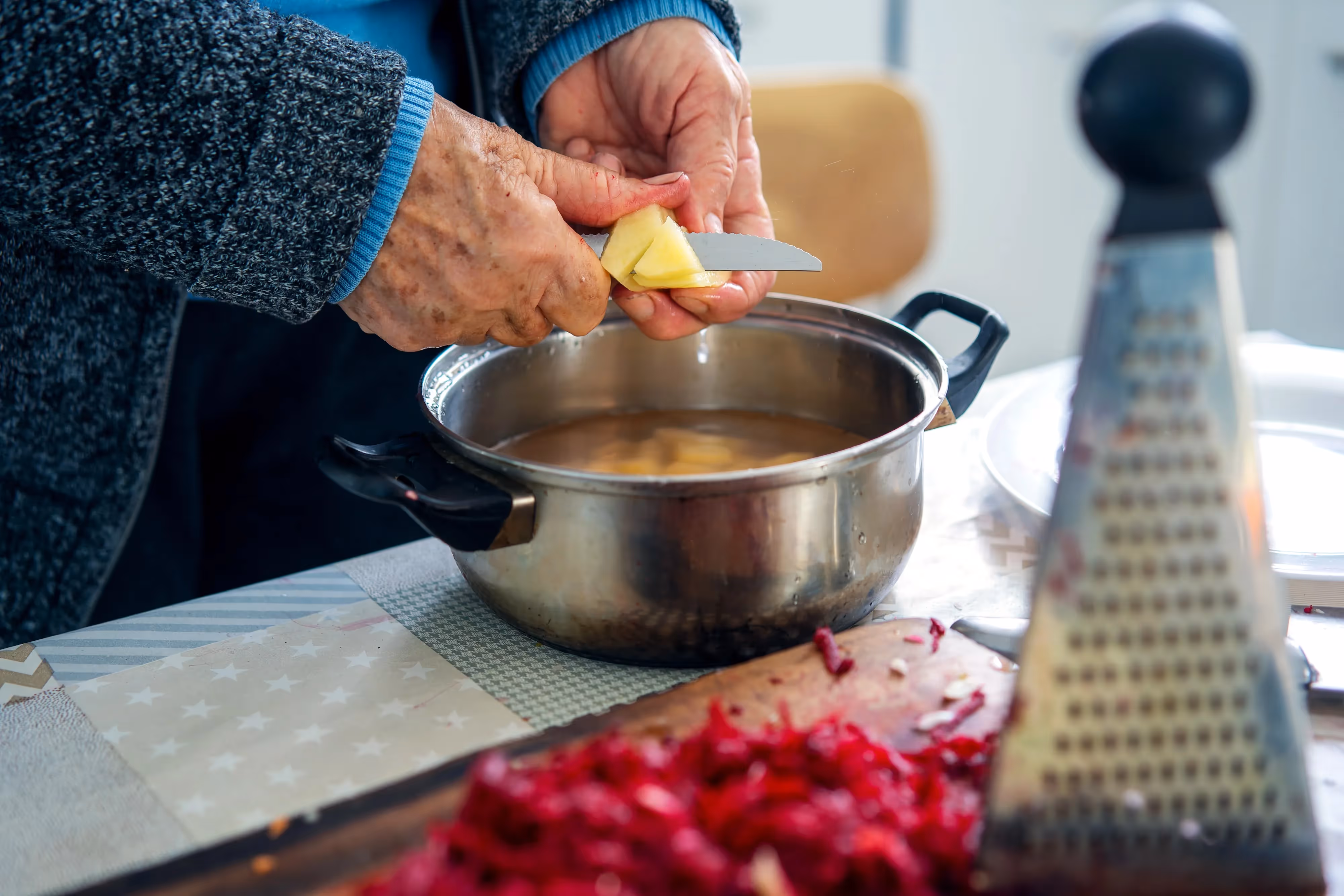 Slicing Potatoes Stock Photo