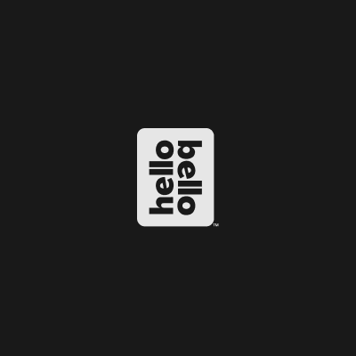 A white rectangular card with the word "hello" printed in a playful, upside-down font on a black background.