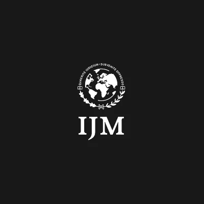Logo featuring a globe surrounded by laurel leaves and the letters "IJM" below.