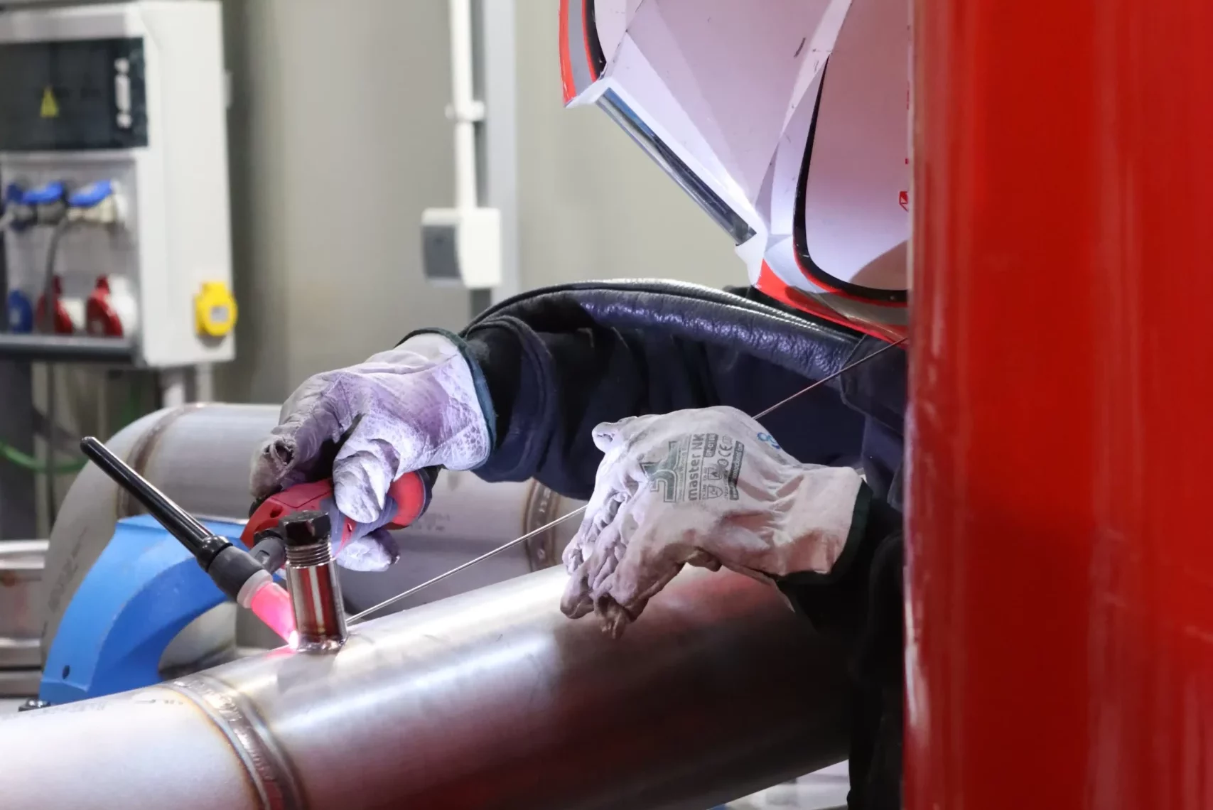 Operator welding a component at INTARCON