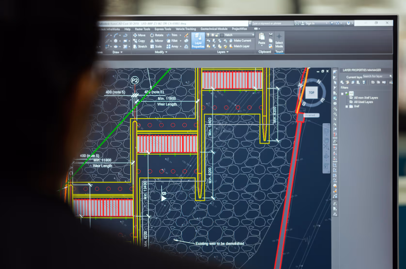 Man looking on construction drawings on his monitor screen