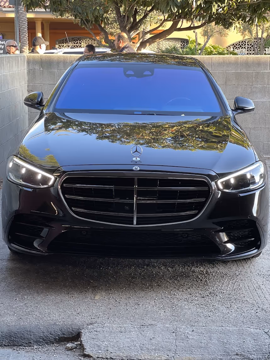 Mercedes  car parked outdoors on the street