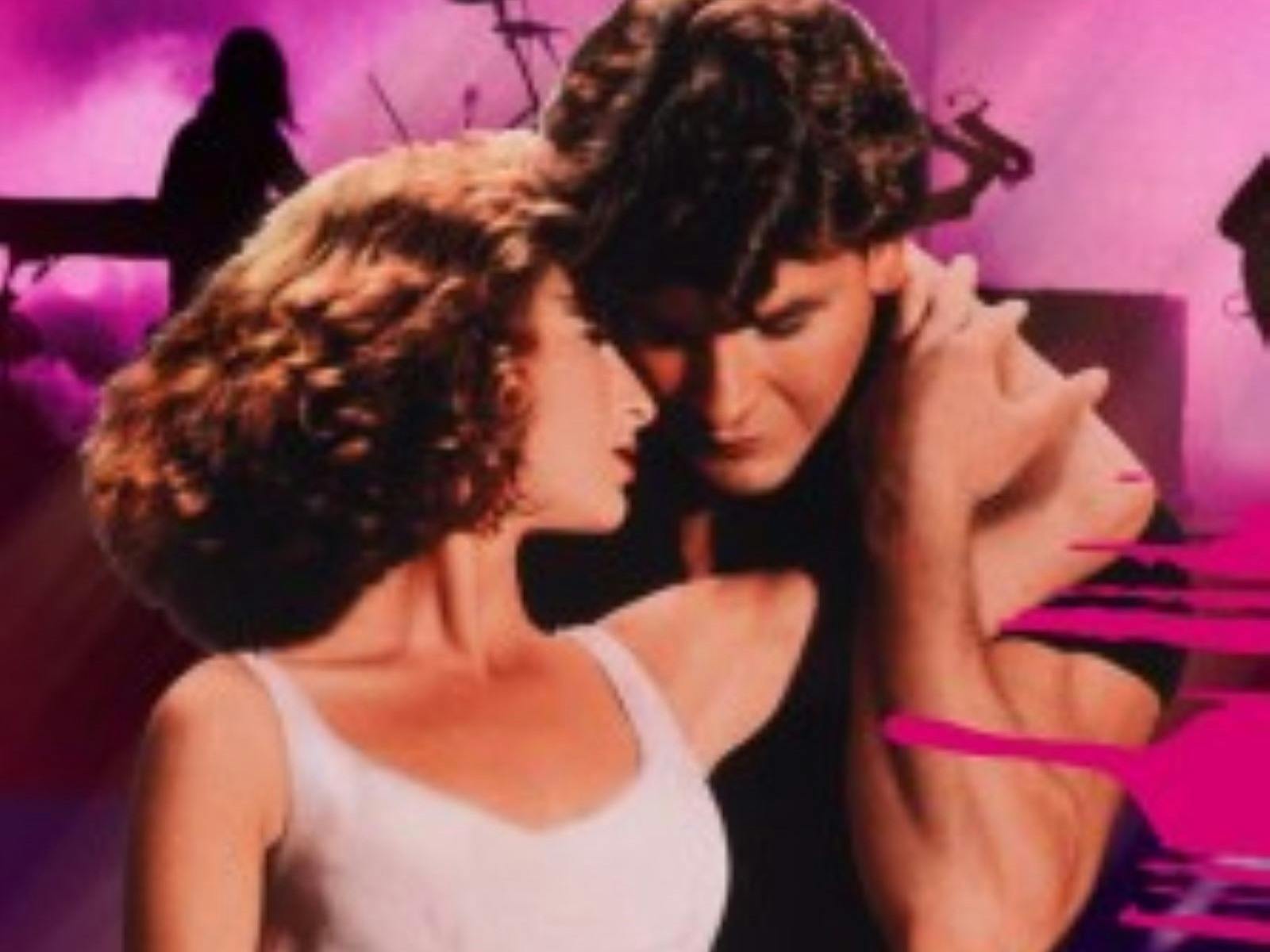 Two main characters holding eachother in front of a pink background mid dance.