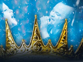 A golden crown in front of a man and a woman singing with a blue coloured light on them