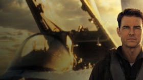 Photo of Tom Cruise in front of an aircraft