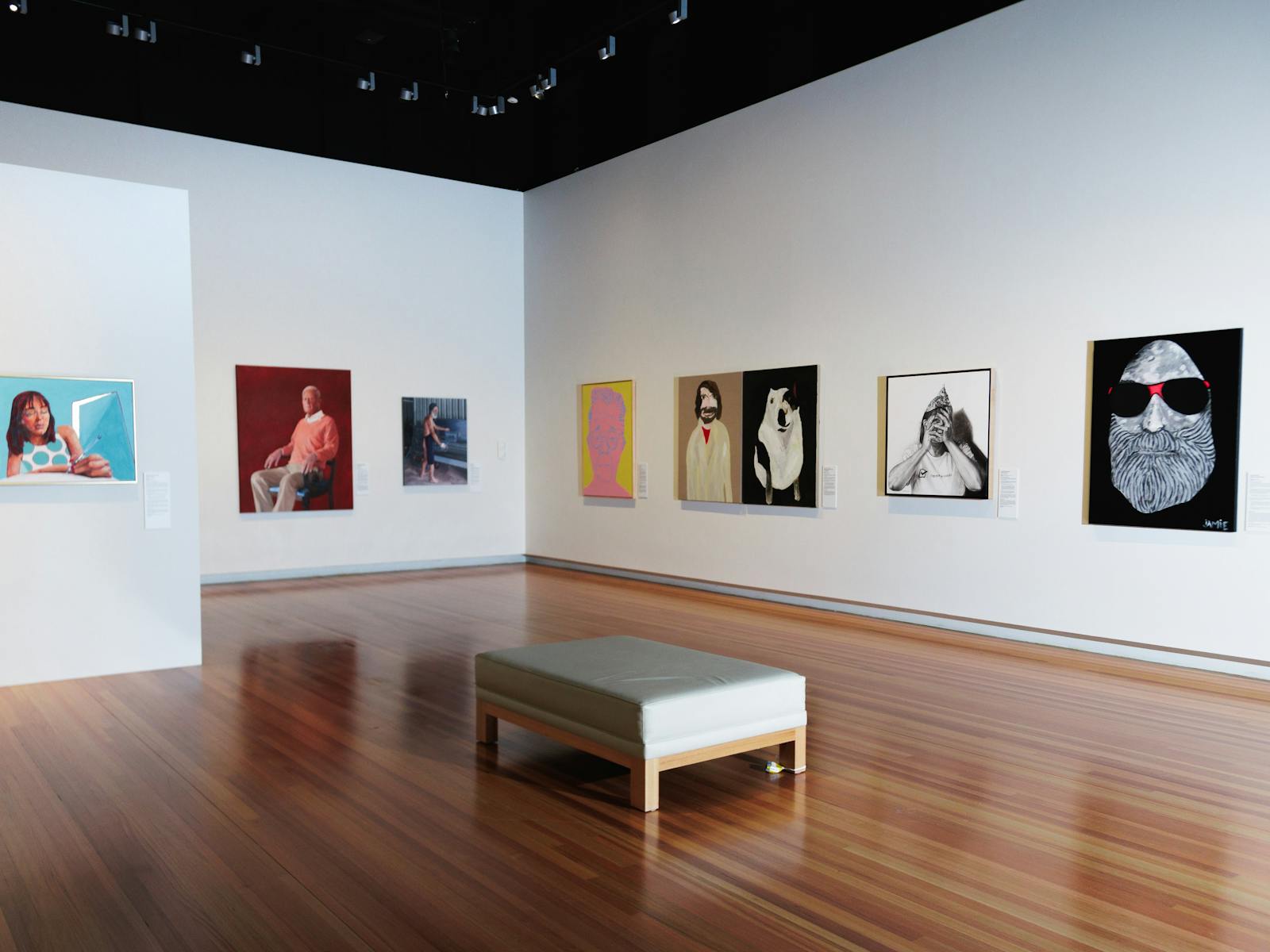 A picture of the gallery with images of some of the finalists artworks