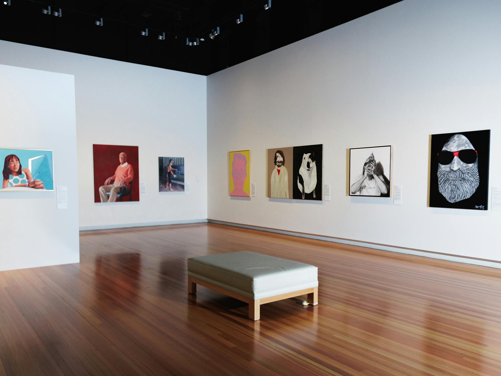 A picture of the gallery with images of some of the finalists artworks