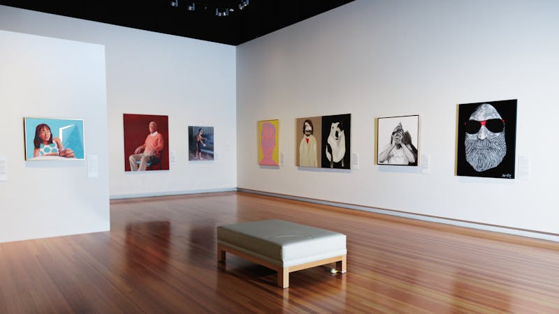 A picture of the gallery with images of some of the finalists artworks