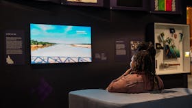A person watching a digital story