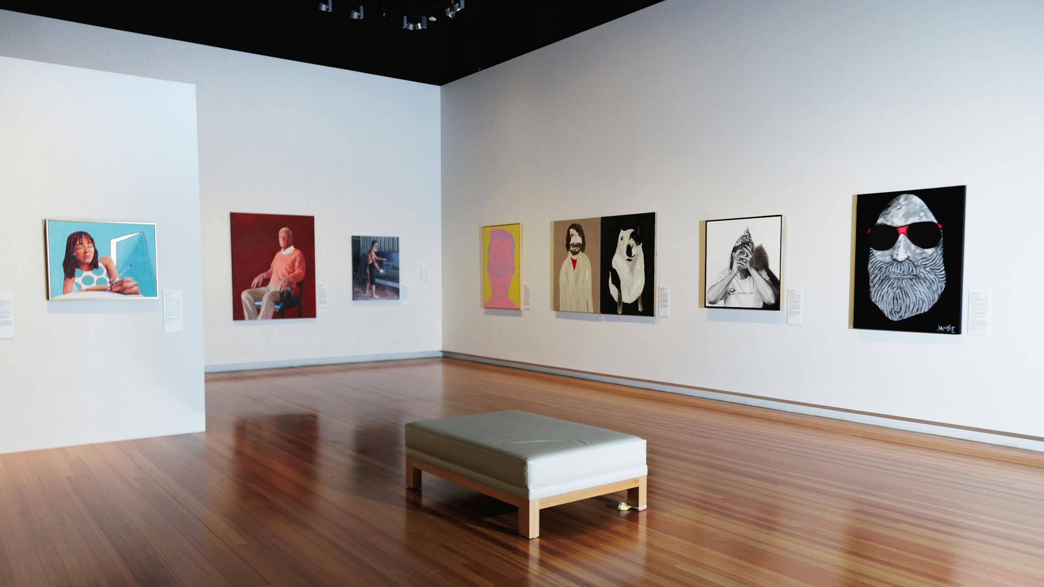 A picture of the gallery with images of some of the finalists artworks