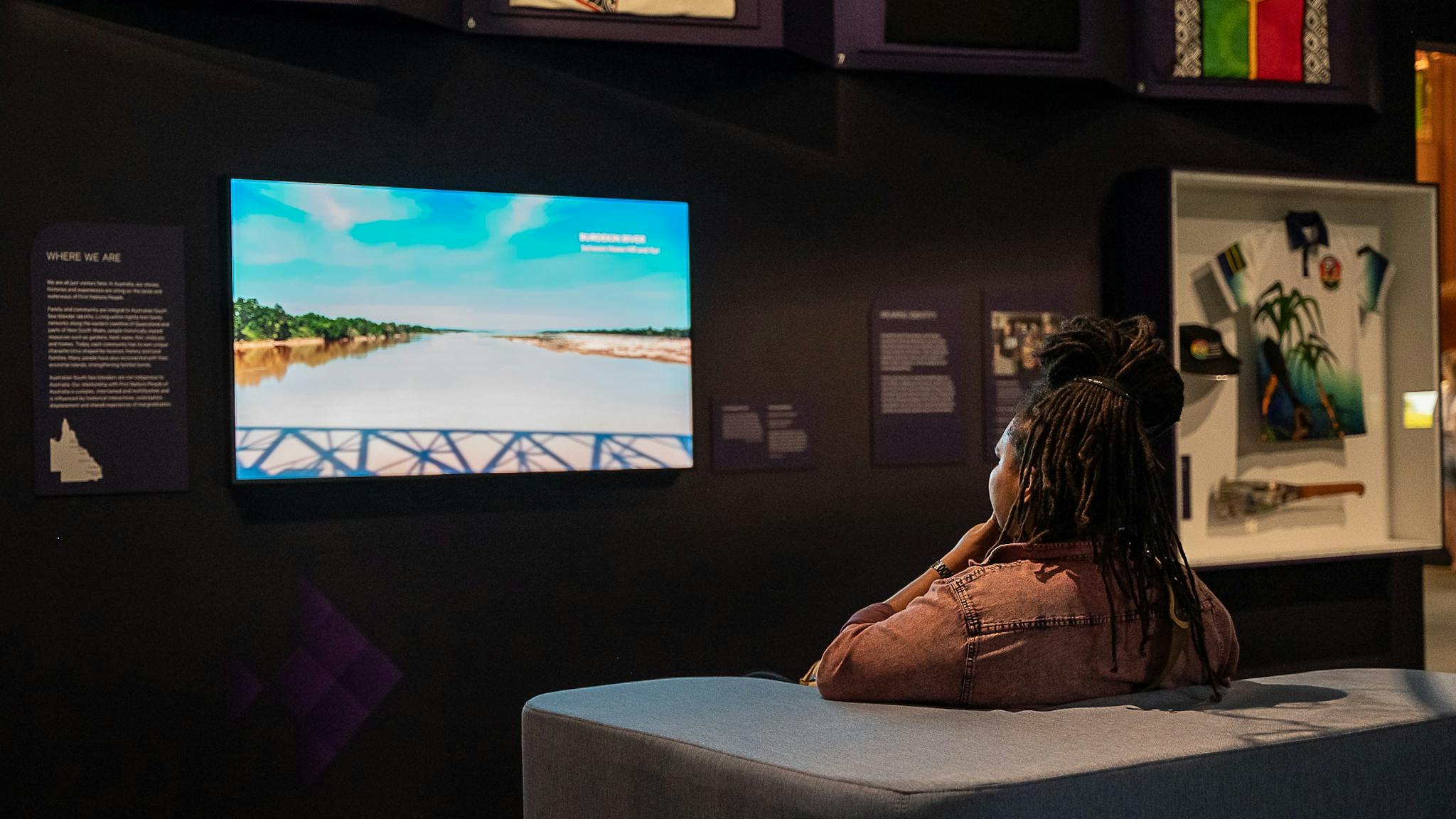 A person watching a digital story
