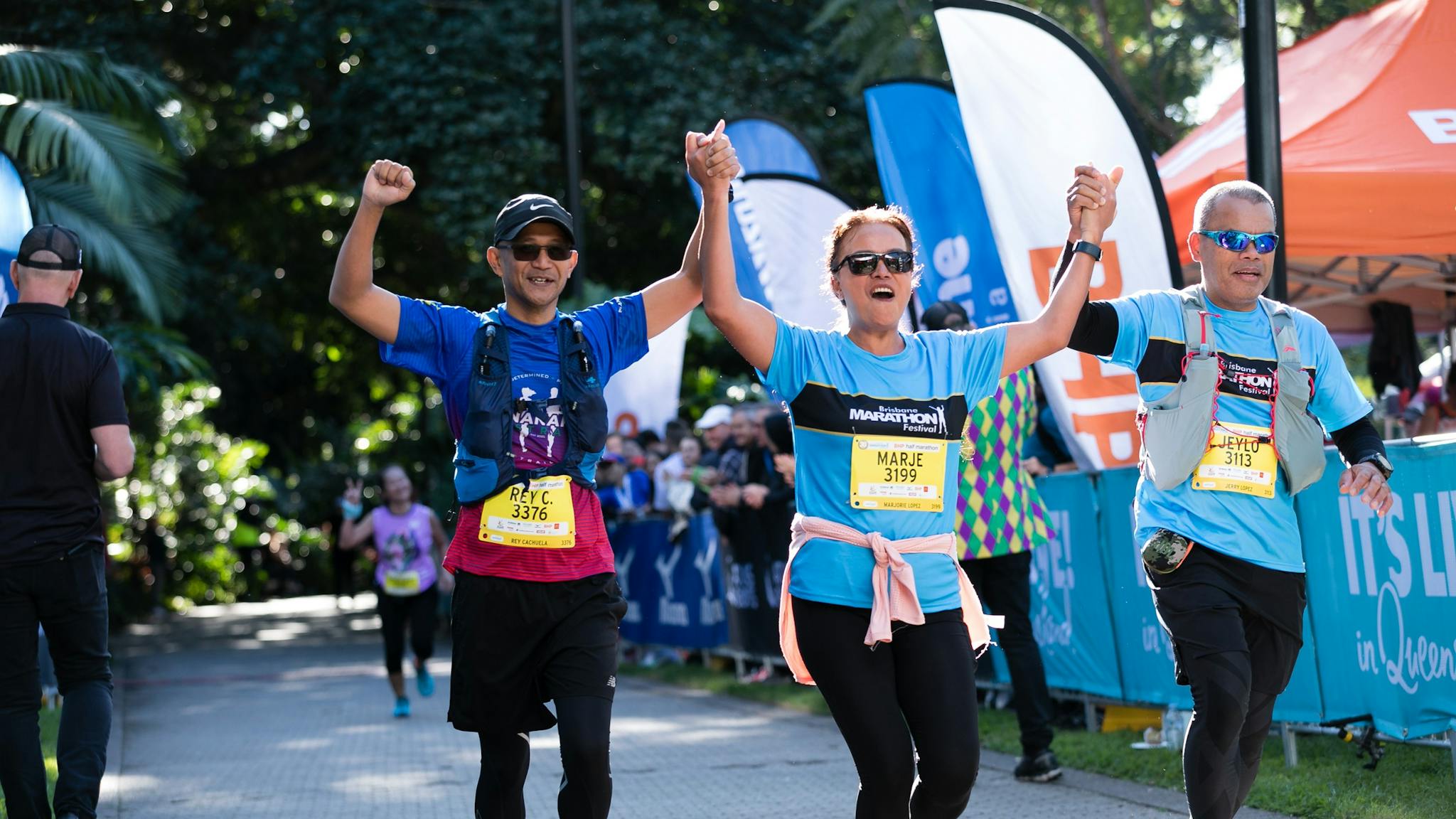 runners finishing run and crossing the finish line