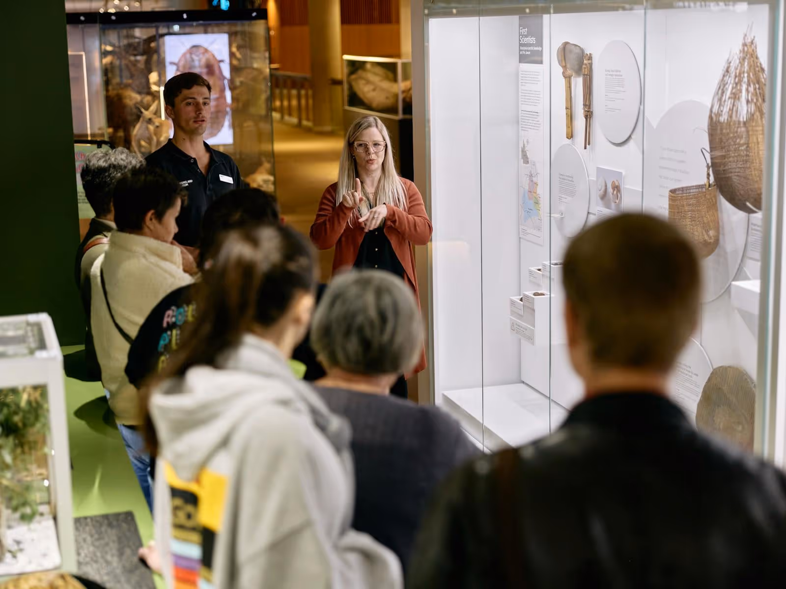 An Auslan interpreter and museum guide lead a tour