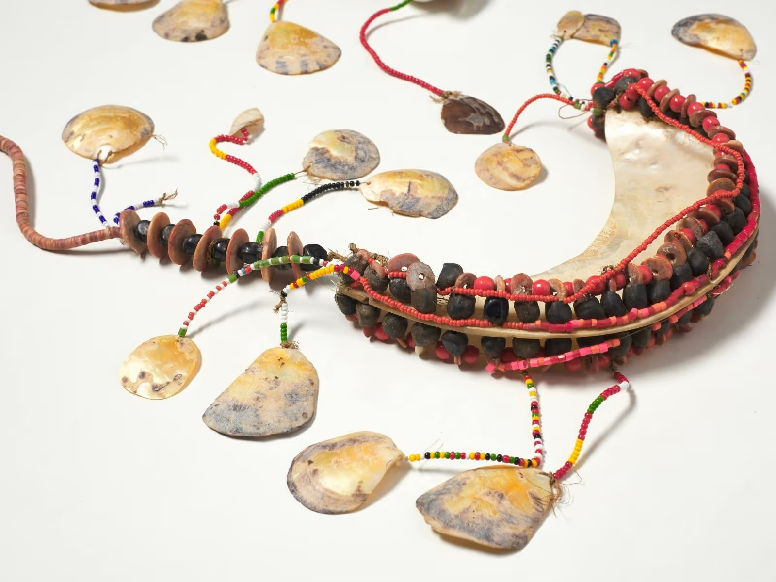 A chest ornament woven with shells and beads.