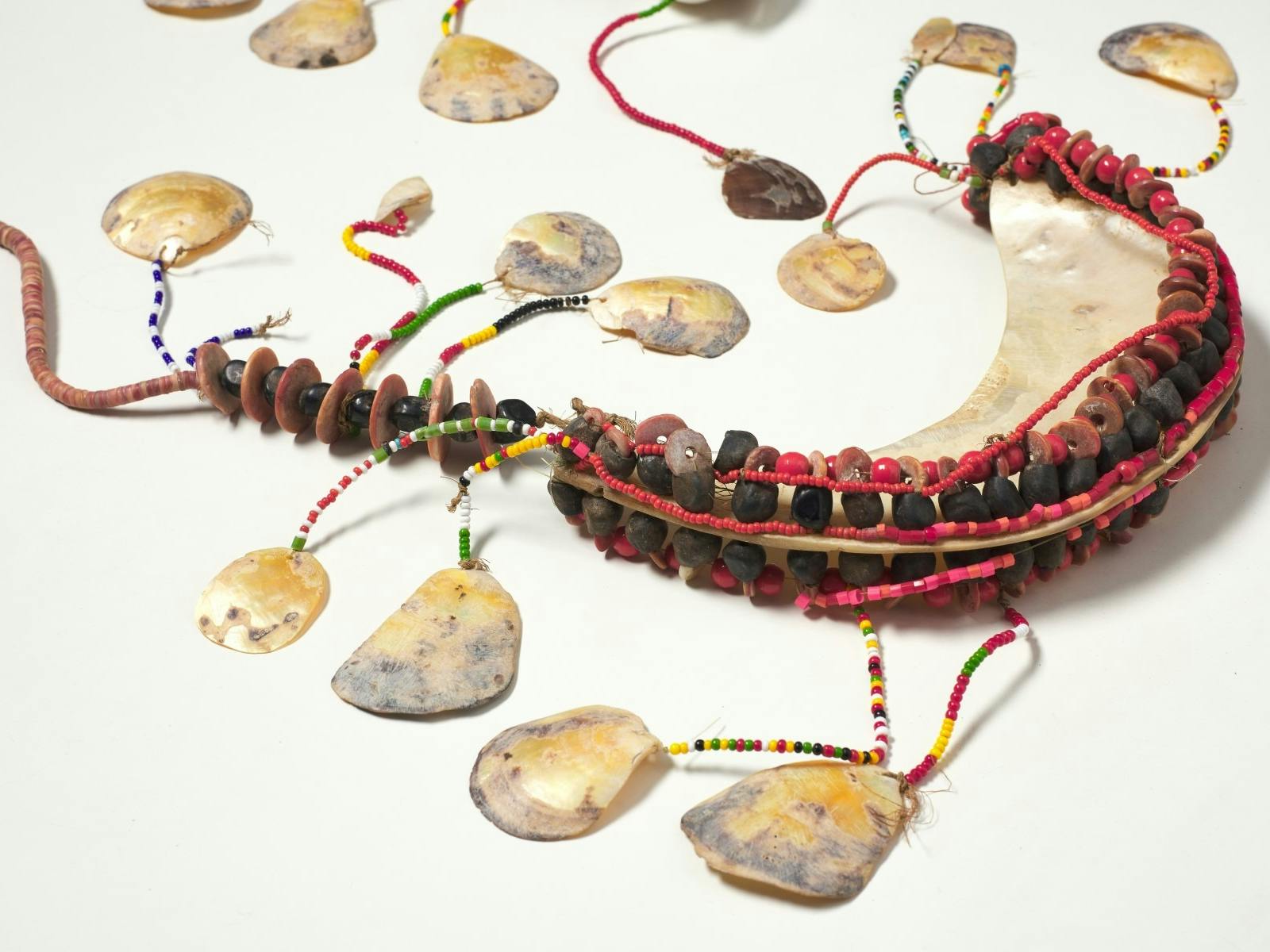 A chest ornament woven with shells and beads.