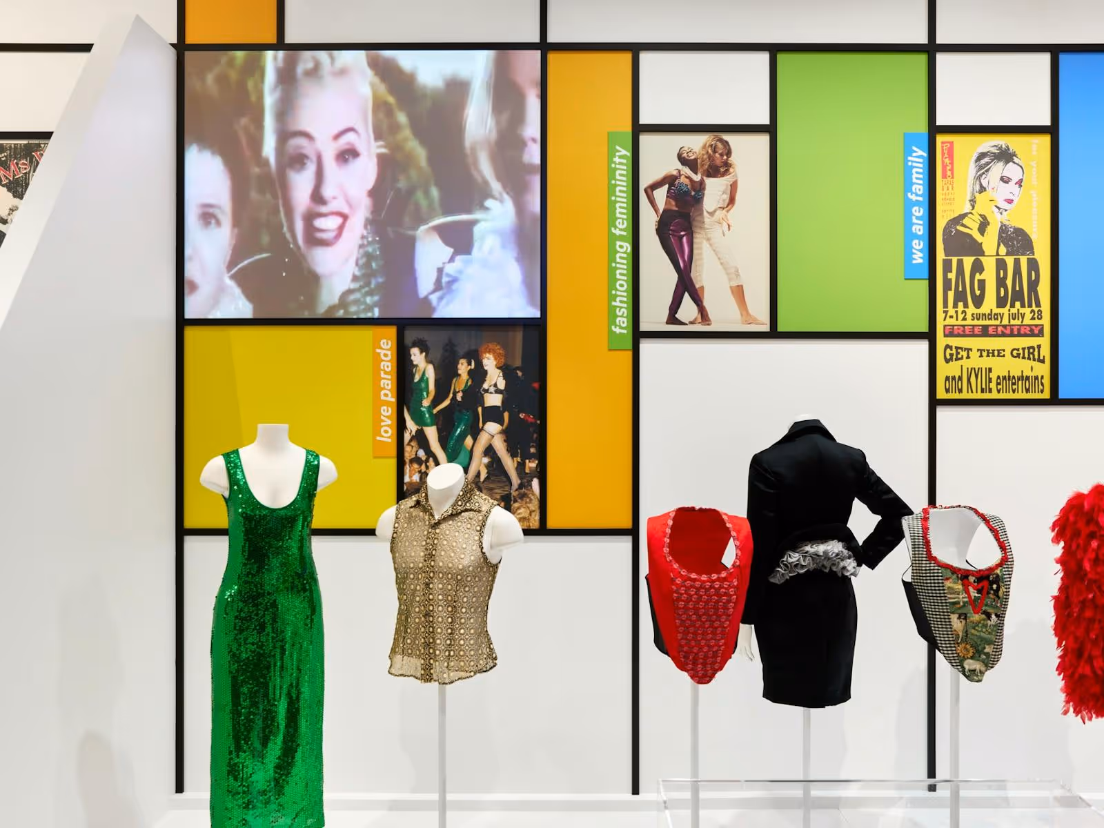 Mannequin bodices display sequined evening wear from the 1990s.