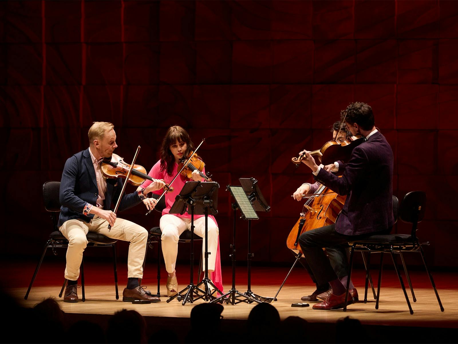 The four members of the Australian String Quartet performing on their Guadagnini instruments.