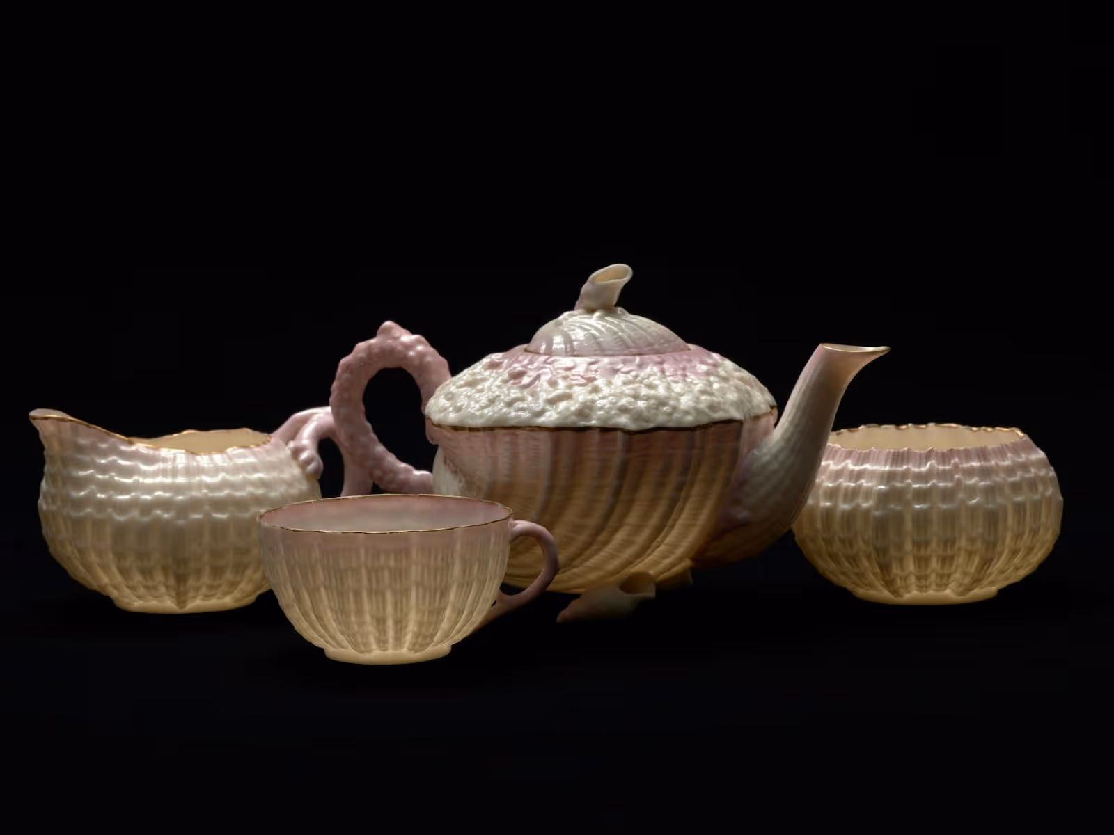 Delicate tea set with ornate cream and pale pink detail
