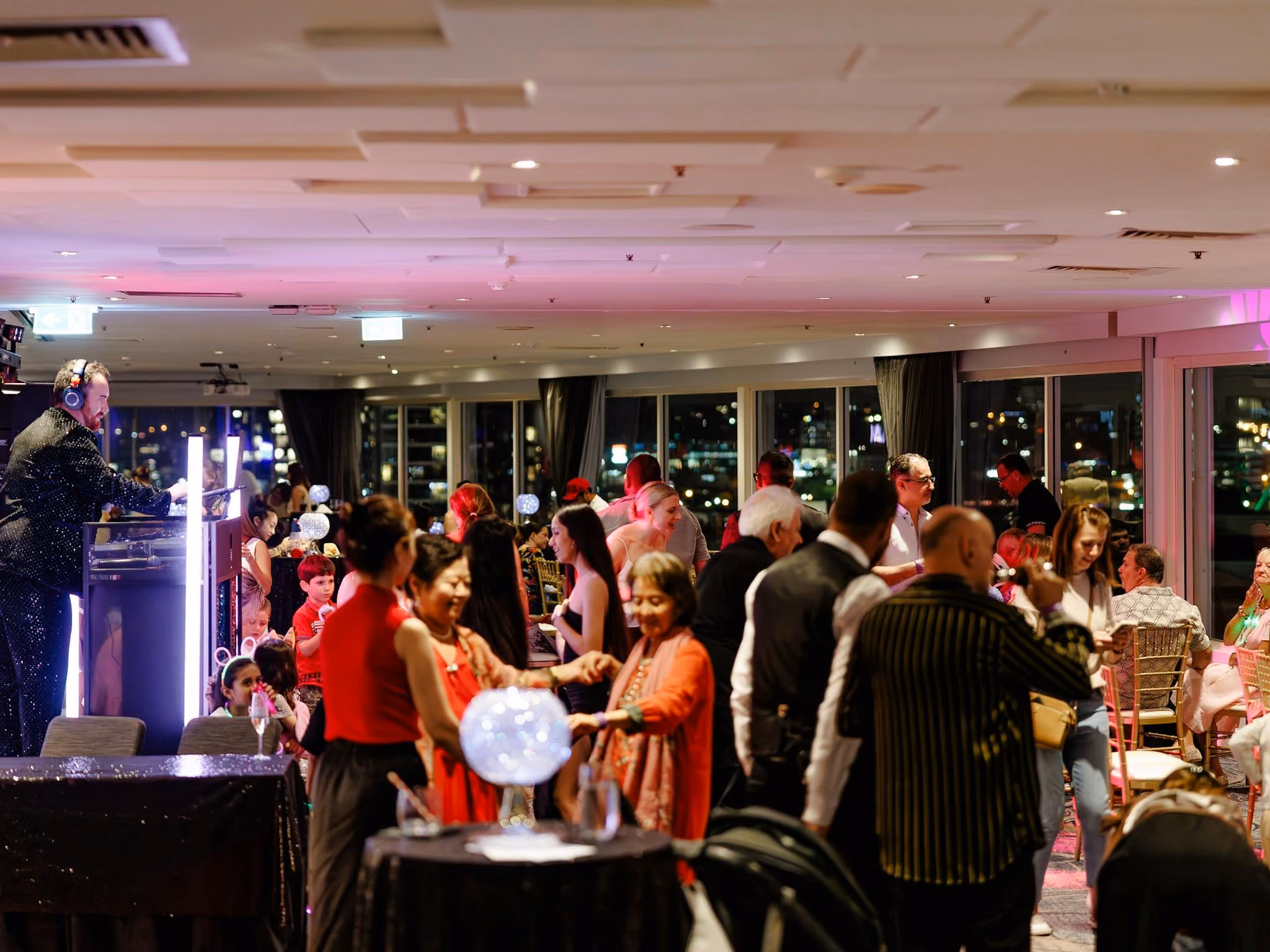 Guests enjoying a festive rooftop event at Rydges South Bank Brisbane
