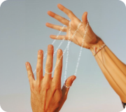 Hands reaching toward each other