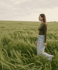 Woman walking through a field