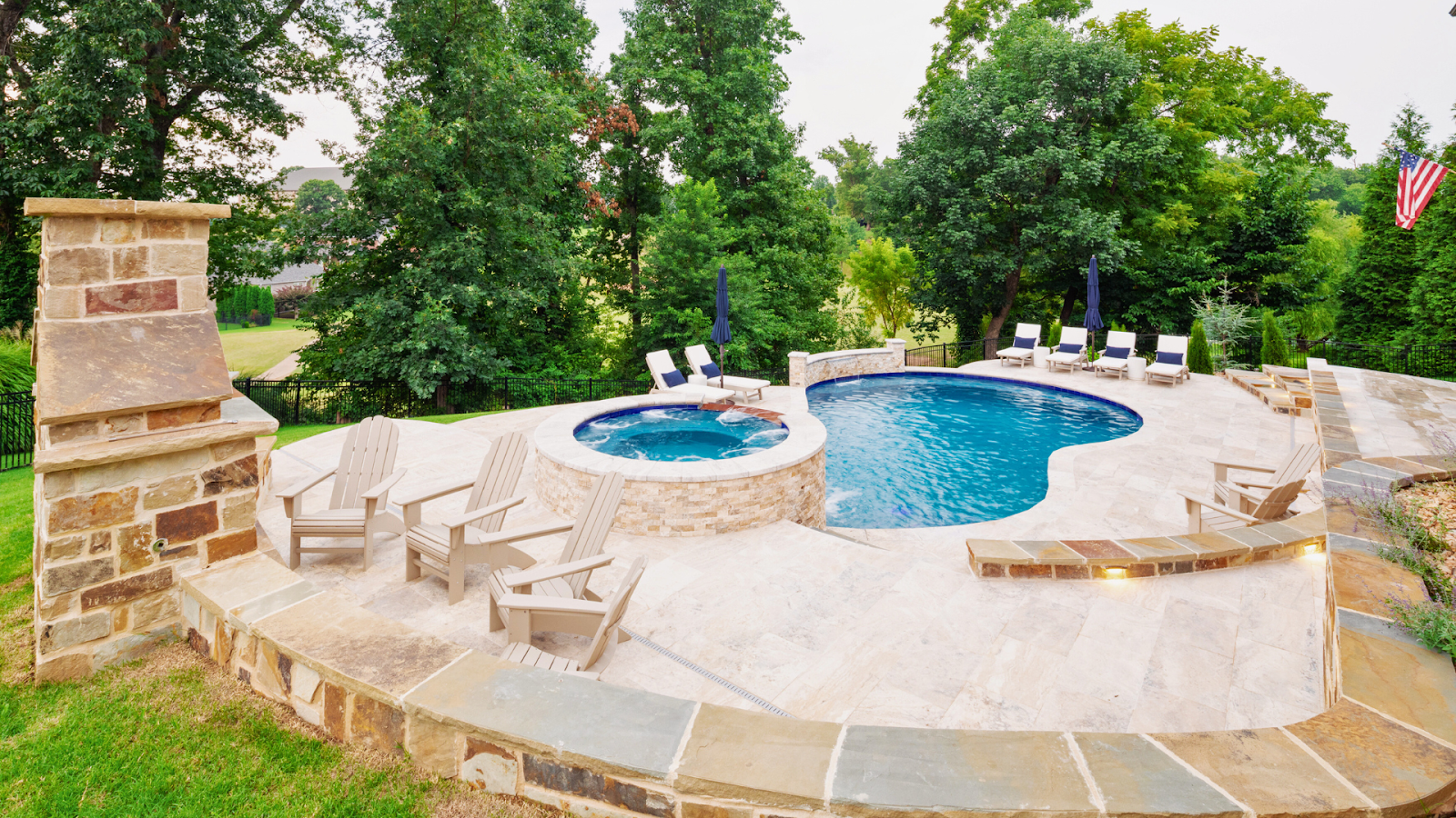 Modern pool design preferences in Northwest Arkansas featuring natural materials and spa features