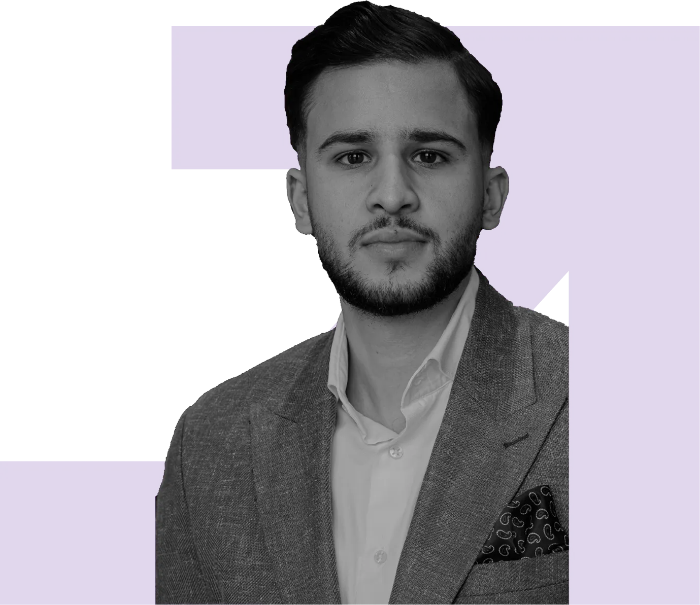 Professional headshot of team member in suit on dark background

