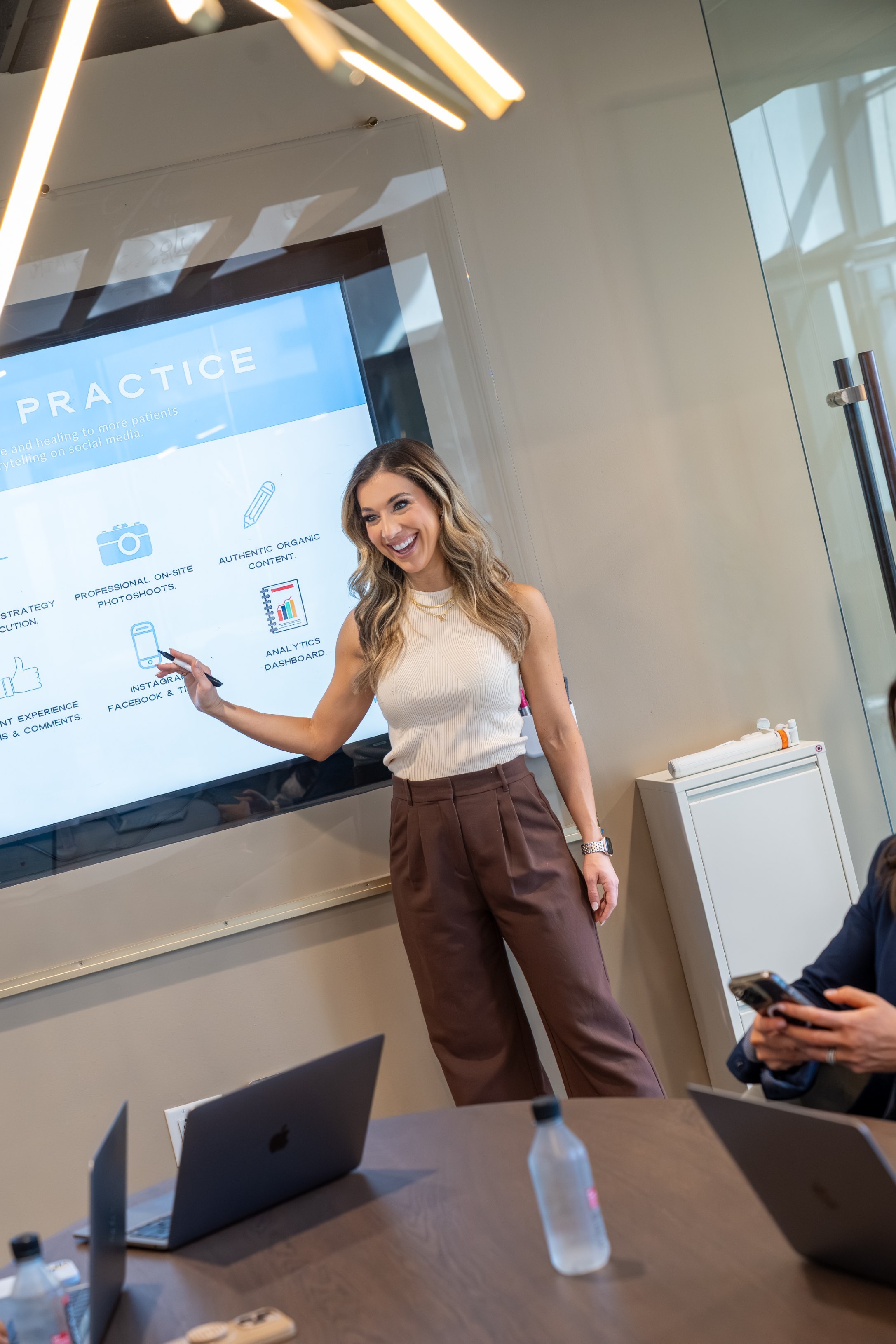 Marketing professionals at a social media firm in Dallas, Texas planning a content strategy and social media campaign for business growth.