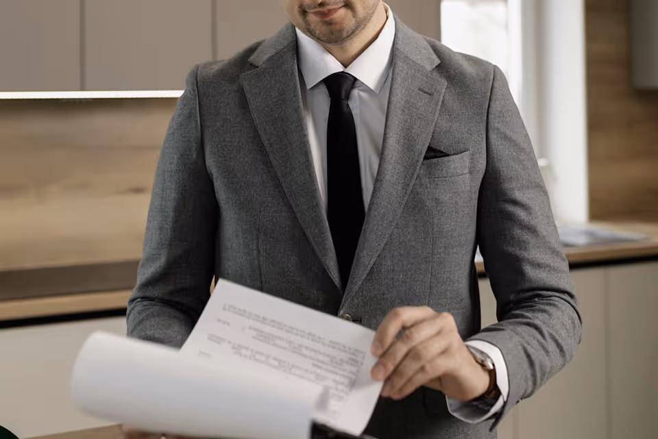Business person reviewing documents in an office