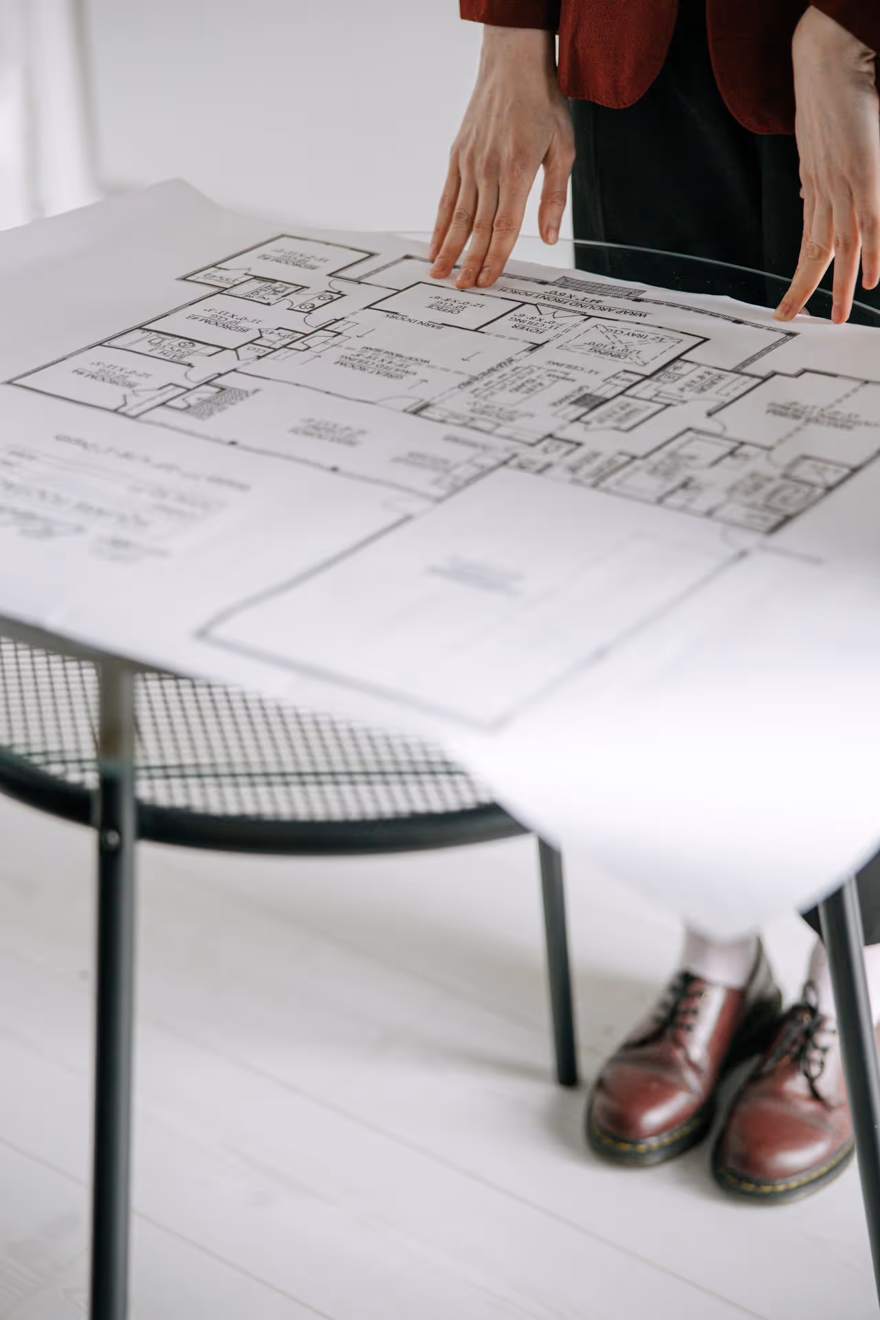 Close-up of a technical floor plan spread on a table