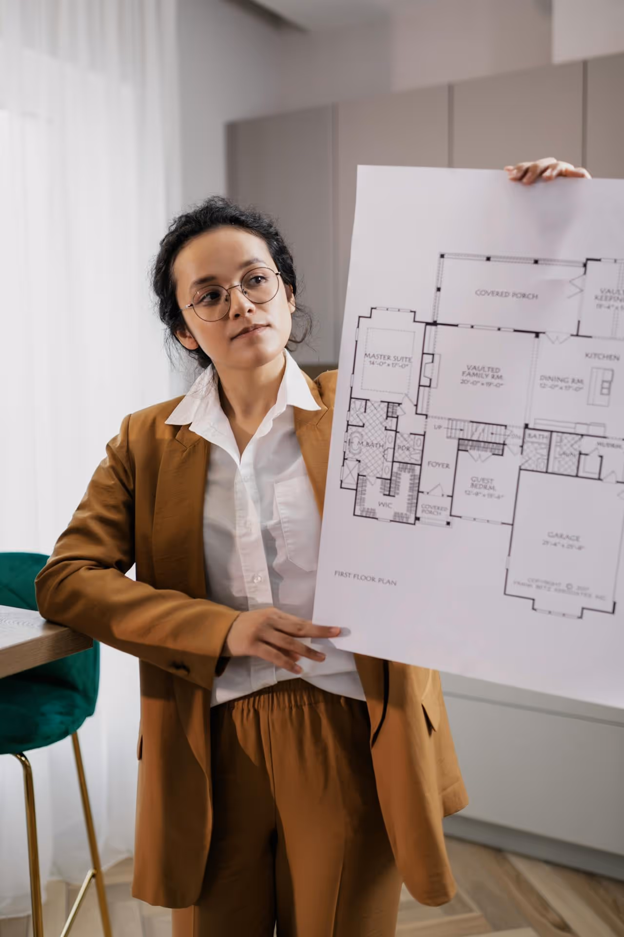 Person showing the floor plan of a property
