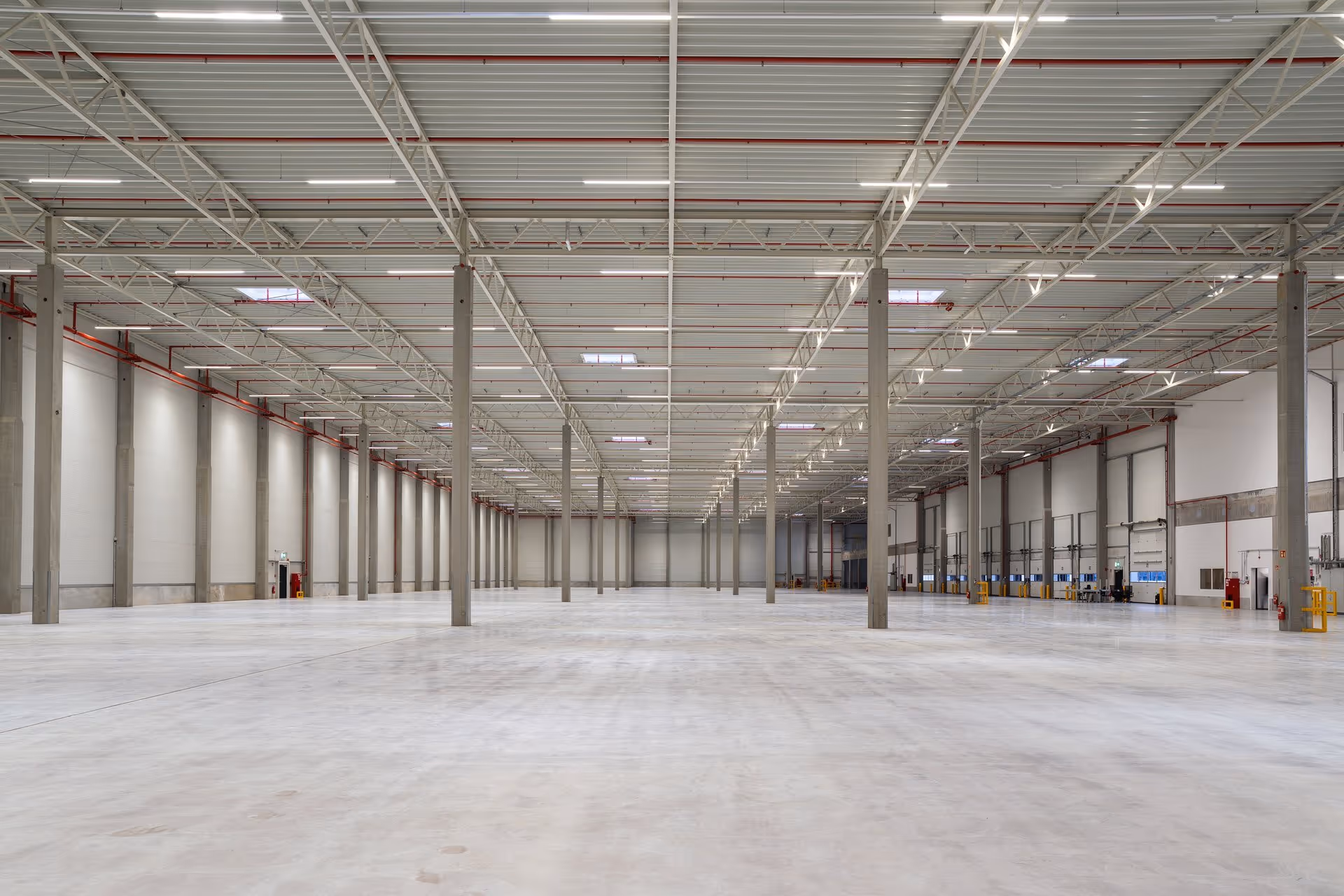 Interior of an empty warehouse with artificial light