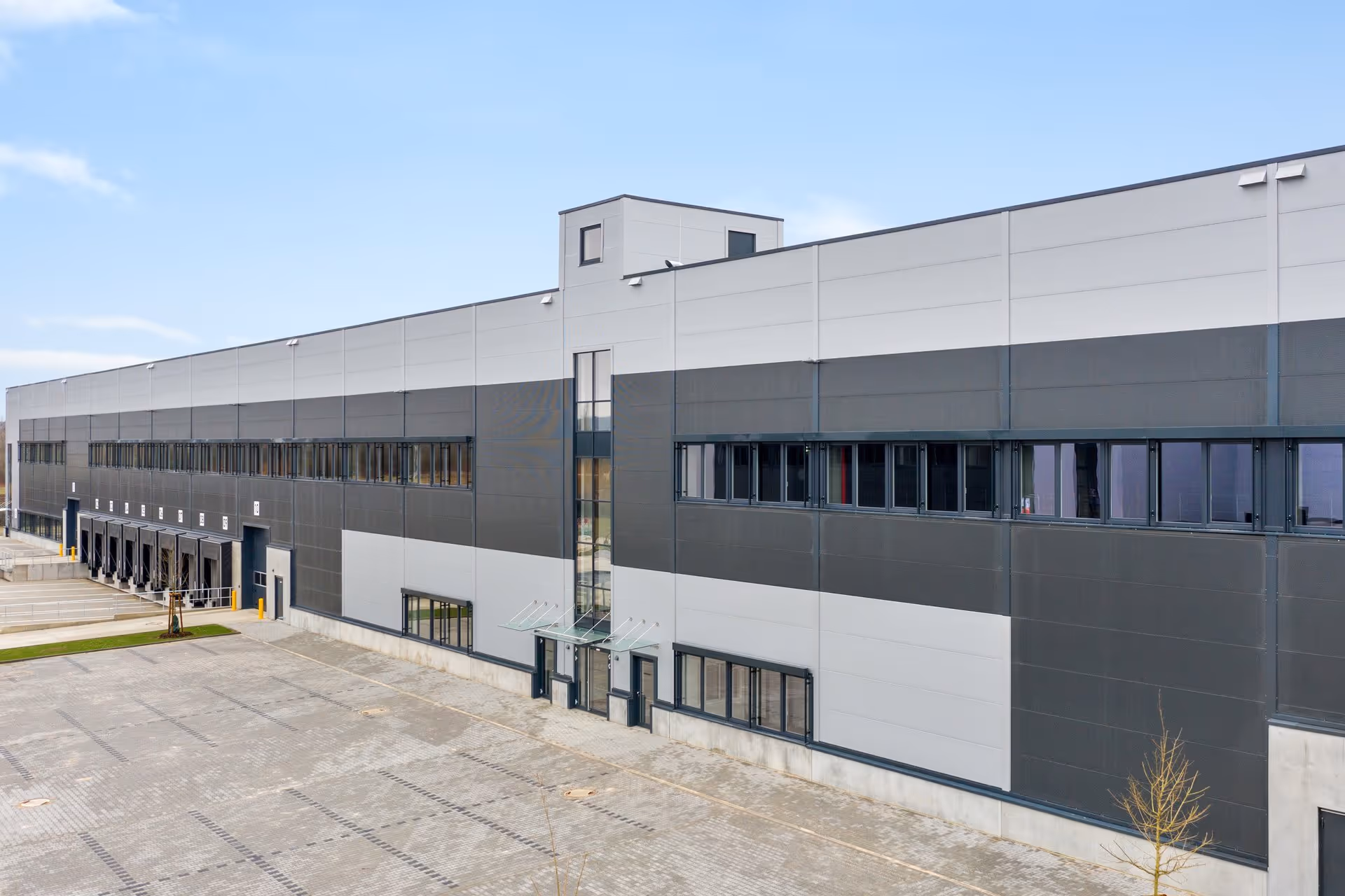 Aerial shot of a warehouse and its truck inlets