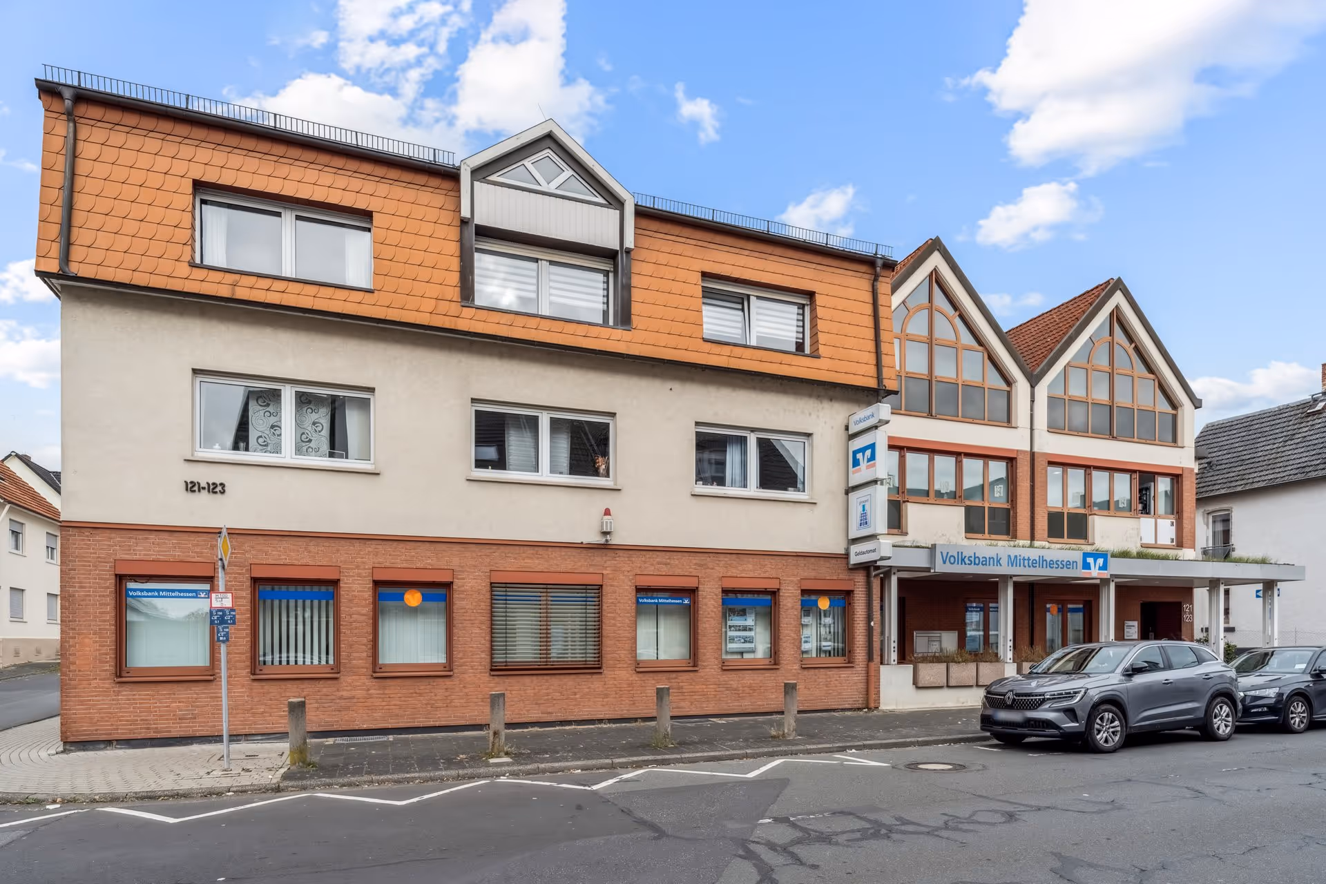 Office lounge area with mid-century chairs and plants