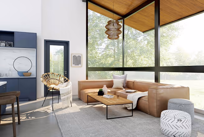 Modern living room with brown leather sofa, wooden coffee table, large windows, and natural light.