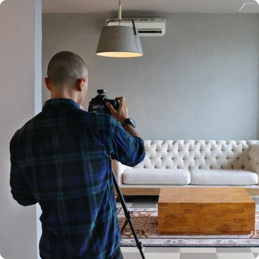 A Backbone photographer capturing a listing on site