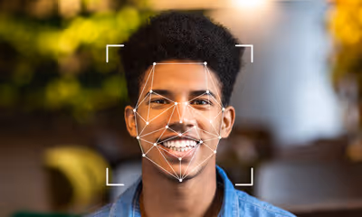 Biometric facial recognition technology used during a remote interview to closely observe for signs of deepfake impersonation, such as lip movement mismatches, lack of blinking, and unnatural facial expressions.