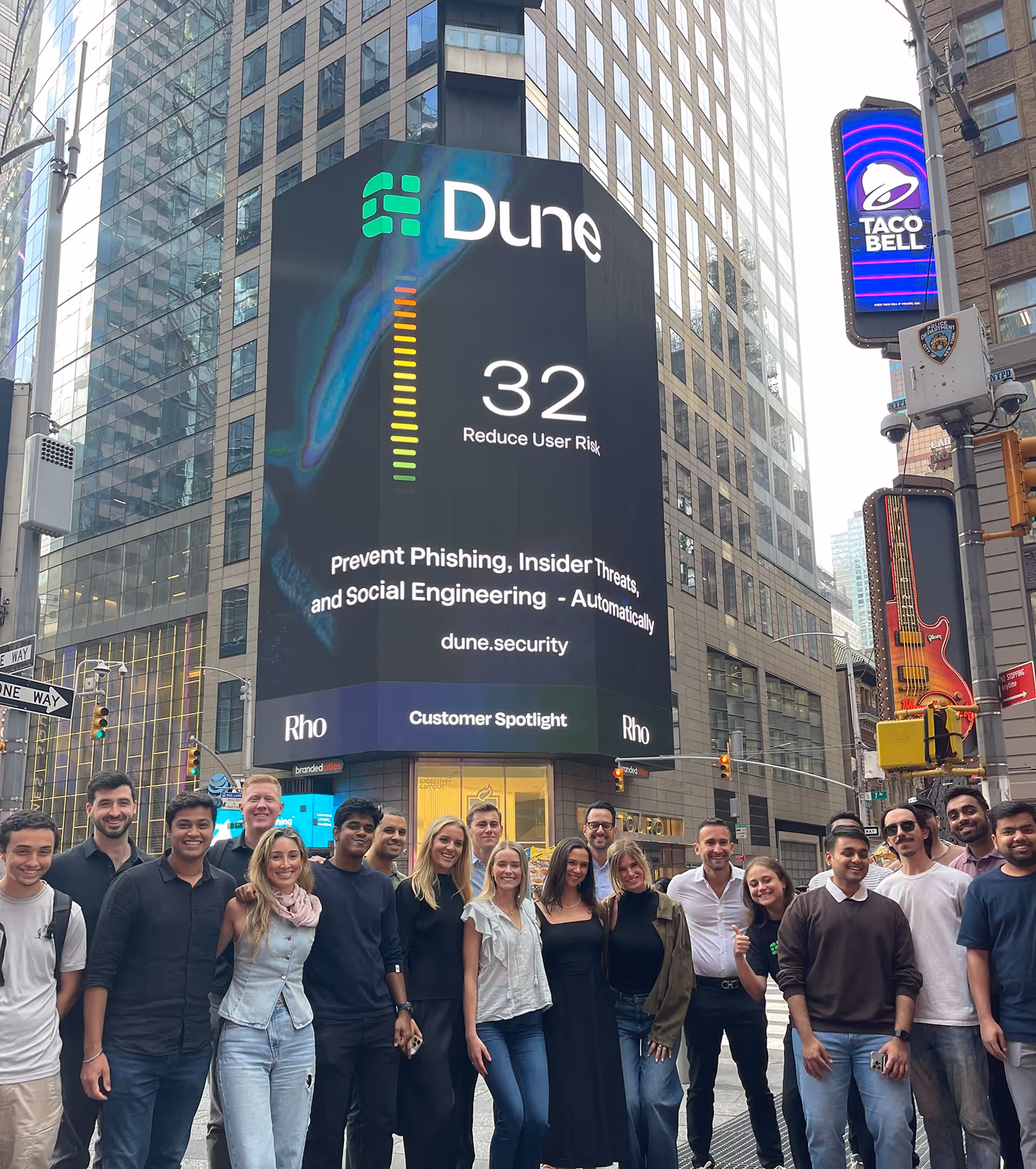 The Dune Security team in Times Square with a six-story billboard celebrating the company’s growth into a cybersecurity platform trusted by Fortune 1000 enterprises, focused on reducing user risk and preventing insider threats and social engineering.