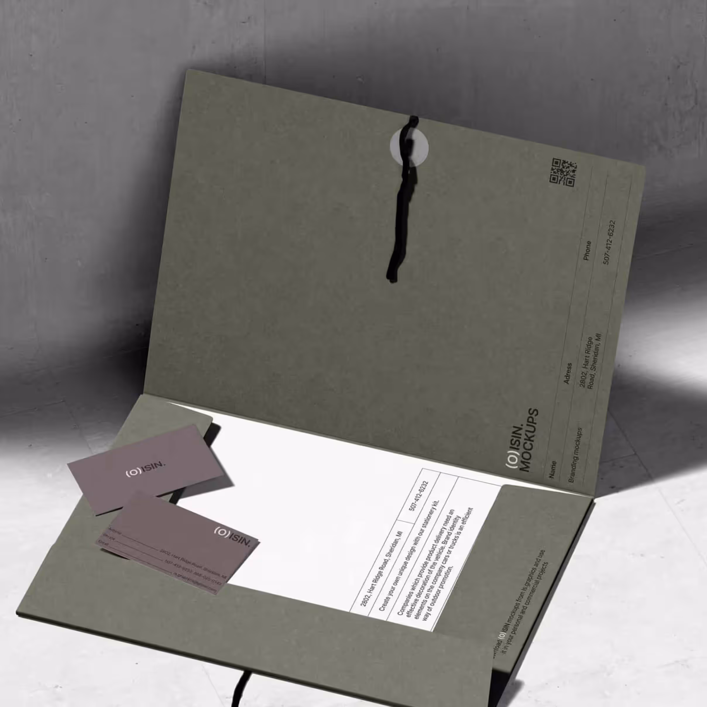 A piece of paper with a business card attached to it.
